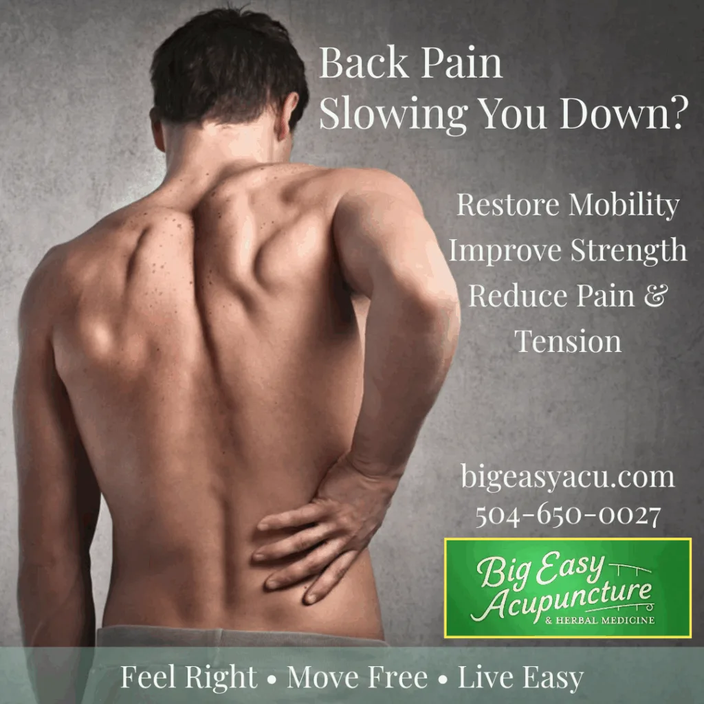 Man holding his lower back in pain, representing low back pain treated with acupuncture at Big Easy Acupuncture in Metairie, LA