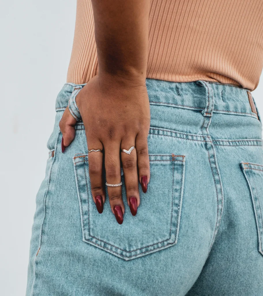 Person placing hand on lateral hip area to represent hip discomfort – Big Easy Acupuncture Metairie LA